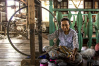 making lotus fabric - inle lake, burma